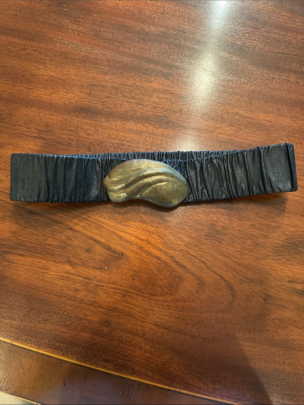 1980’s Small cinched-waisted black ruched leather belt w/ Gold Sculpted Buckle